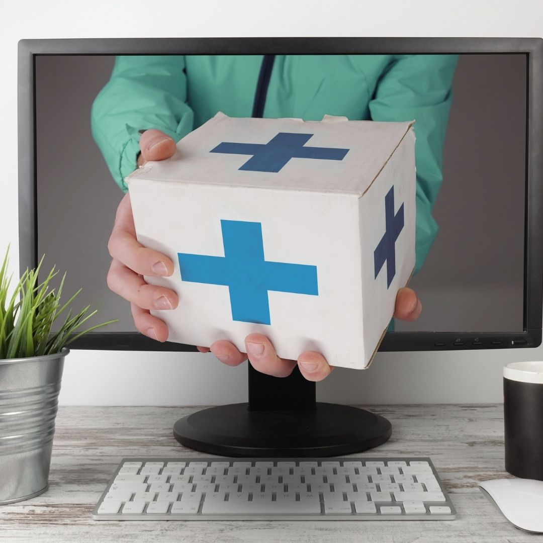 Man reaching from monitor to deliver prescription