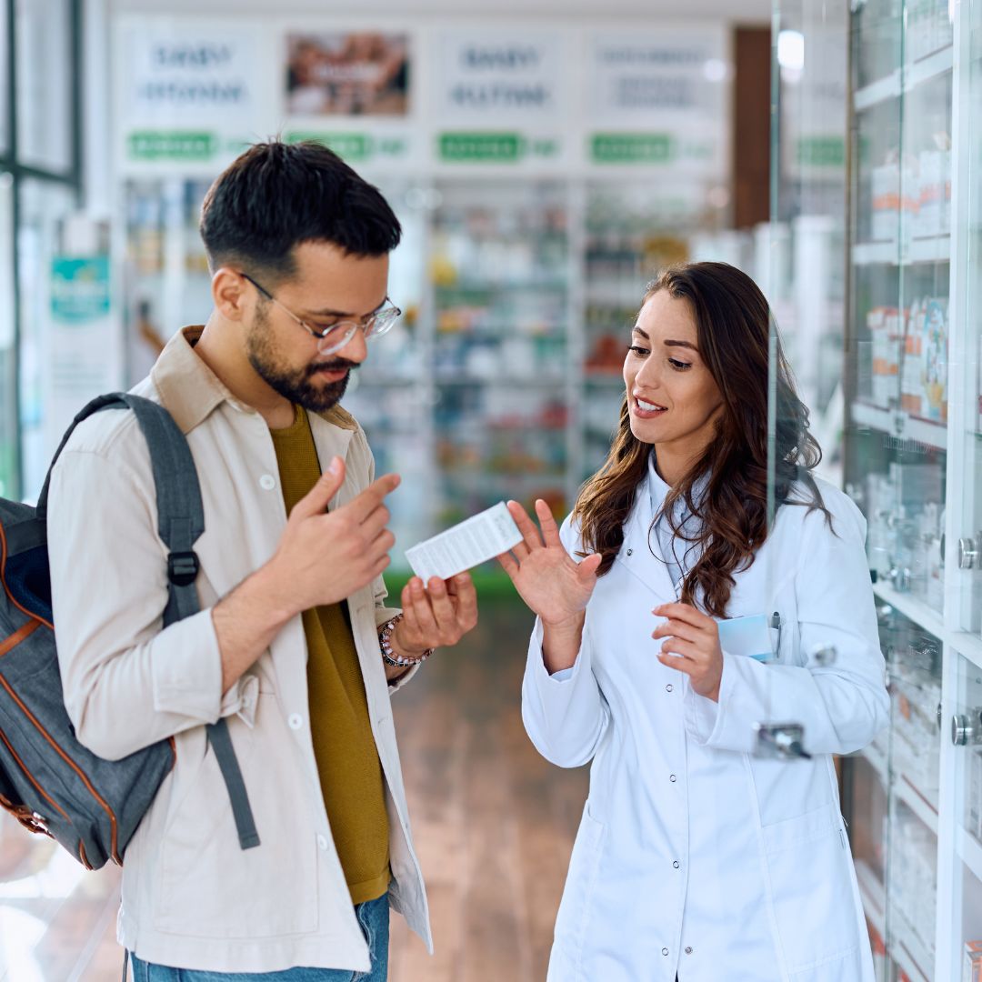 A Pharmacist talking to a customer