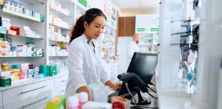 A pharmacist using a computer