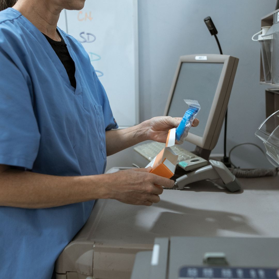 pharmacist filling medication